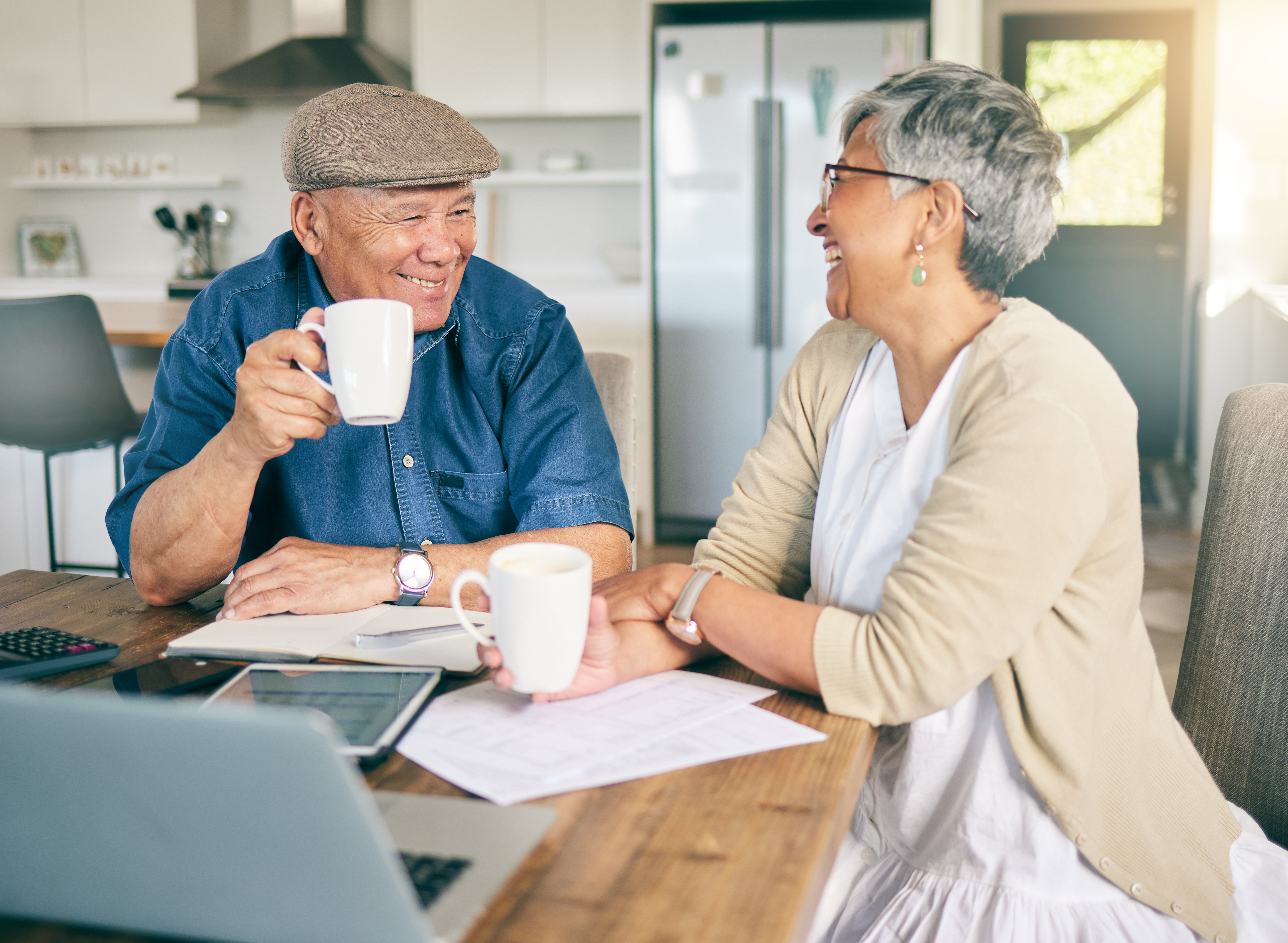 A senior couple reviewing documents together at home.